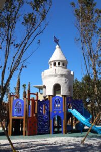 Colorful playground with castle-themed tower at Siesta Beach in Sarasota