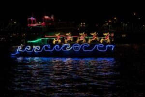 Boats decorated with Christmas lights gliding along Sarasota Bay during the annual parade.