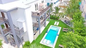 Modern Siesta Key vacation rental with a private pool, sun loungers, and spacious balconies—ideal for group getaways.