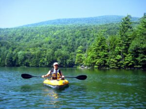 Kayaking on a peaceful Vermont lake with Green Mountain views
