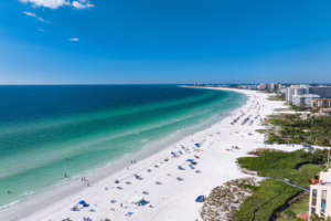 Beach scene in Siesta Key, Sarasota, Florida with white sand and ocean view.