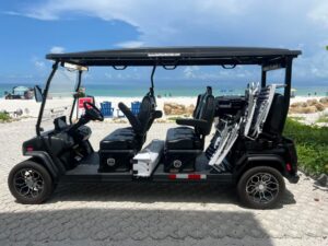Hodo’s golf cart rental parked near Siesta Key beach
