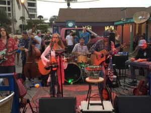 Live music performance at The Blasé Café & Martini Bar in Siesta Key Village, featuring local musicians and a lively atmosphere for guests enjoying food, cocktails, and island nightlife.