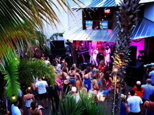 Live band entertaining a crowd at Gilligan’s Island Bar & Grill in Siesta Key, Florida, showcasing the vibrant nightlife and live music scene in Siesta Key Village.