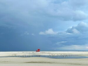 Storm clouds approaching Siesta Key Beach during Florida's rainy season
