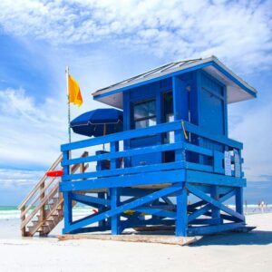 Blue lifeguard stand on the white sand of Siesta Key Beach Florida